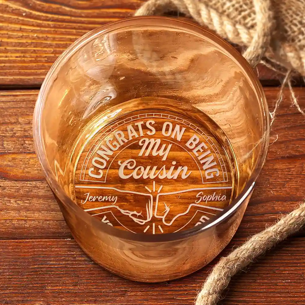 Personalized whiskey glass engraved with 'Congrats on being my cousin' text, perfect gift for cousins.